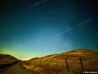 Milky Way over Golden Foothills – Milky Way over golden foothills and a fence line, Northern California. Oct 2023. John England.