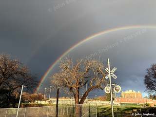 Double Rainbow at the Crossing – Double rainbow over the Chico State fields and rail crossing, Chico, CA.