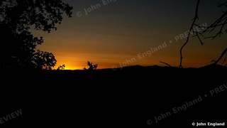 Ember Sunset – Deep orange sunset over a silhouetted ridge, Northern California, Jun 21, 2019.