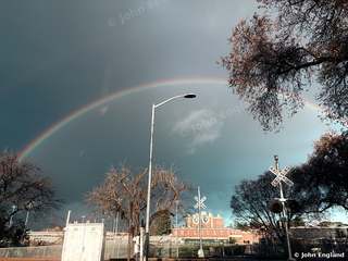 Winter Rainbow at the Crossing – Winter rainbow over a railroad crossing near Chico State, Chico, CA.