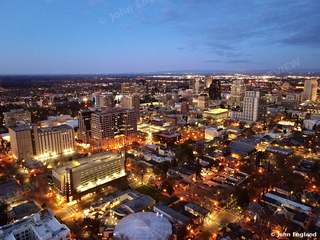 Downtown Sacramento Lights from Above – Aerial view of downtown Sacramento at dusk, city lights coming on, Sacramento, CA. Mar 2022. John England.