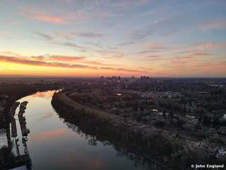 River Bend at Golden Hour – Aerial of the river curving under a glowing sunset sky.