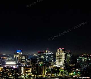 Skyline Lights at Night – Aerial night skyline with lit towers.