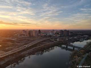 Sunset Over River and Bridges – Aerial sunset over the river, bridges and skyline.