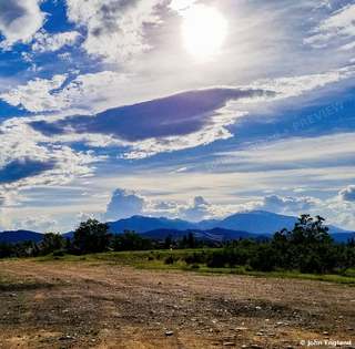 Mountain Under Summer Clouds – A mountain under summer clouds. John England.