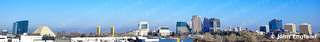 Downtown Skyline Panorama Under Clear Blue Sky – Wide panorama of a downtown skyline under clear blue sky. Jan 17, 2021. John England.
