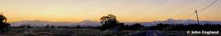 Sunset Panorama near Anderson – Afterglow panorama over distant mountains and a country road near Anderson, Shasta County. Jul 15, 2020. John England.